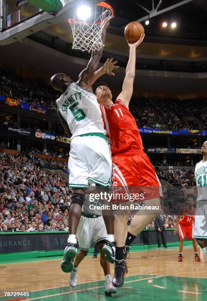 Yao Ming of the Houston Rockets goes up for a shot against Kevin Garnett of the Boston Celtics on January 2, 2008 at the TD Banknorth Garden in...