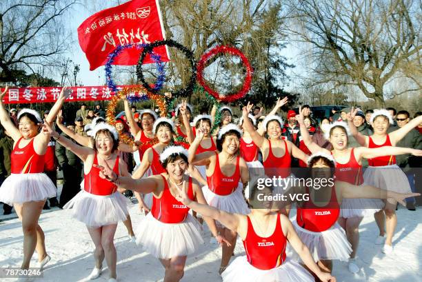Polar bear swimmers in ballet dress perform in the snow on January 1, 2008 in Shenyang, Northeast China's Liaoning Province. More than 200 swimmers...