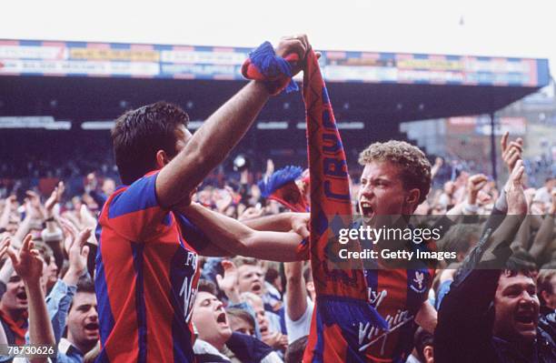 Crystal Palace fans celebrate their teams 3-0 win over Blackburn after extra time in the second leg of the play off-final at Selhurst Park, London,...