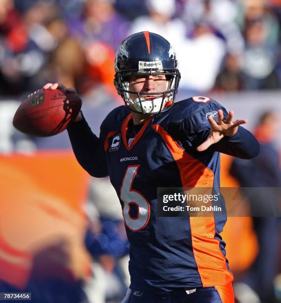 Quarterback Jay Cutler of the Denver Broncos passes the ball at an NFL game against the Minnesota Vikings at Invesco Field at Mile High, on December...