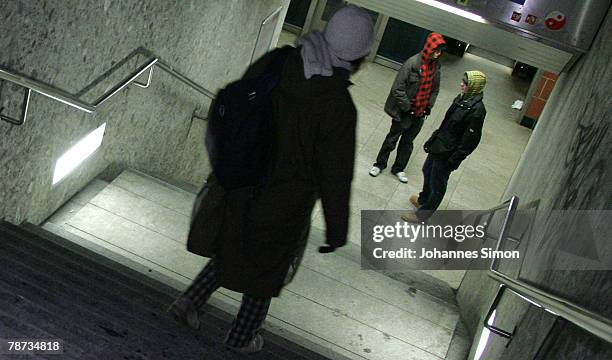 Woman walks down a staircase to Underground Station Kieferngarten on January 3, 2007 in Munich, Germany. After an elder man was attacked by juvenile...