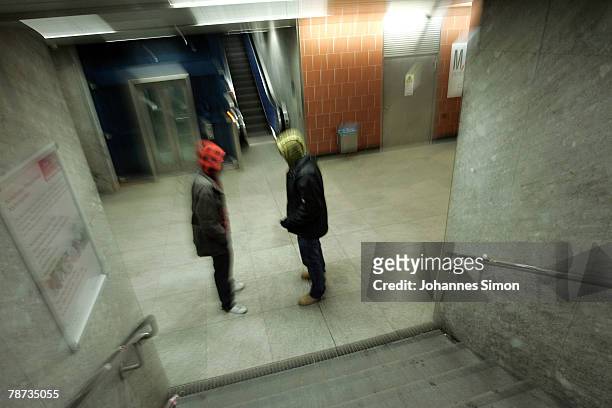 Two young men meet in the basement of Kieferngarten Underground Station on January 3, 2007 in Munich, Germany. After an elder man was attacked by...