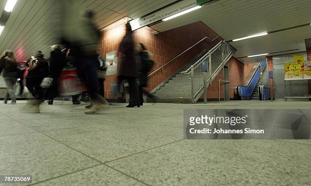 Passengers dash around at the basement of Kieferngarten Underground Station on January 3, 2007 in Munich, Germany. After an elder man was attacked by...