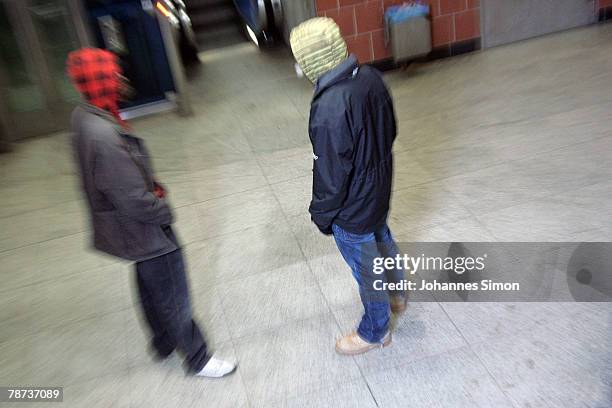 Two young men meet in the basement of Kieferngarten Underground Station on January 3, 2007 in Munich, Germany. After an elder man was attacked by...