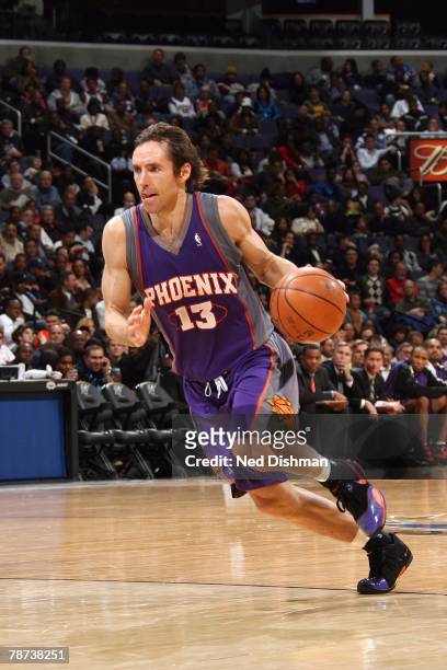 Steve Nash of the Phoenix Suns moves the ball up court during the game against the Washington Wizards at the Verizon Center on December 7, 2007 in...