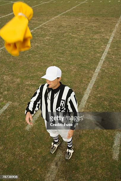 referee throwing penalty flag - penalty flag stock pictures, royalty-free photos & images