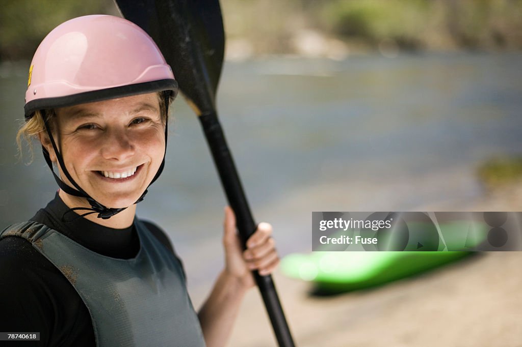 Whitewater Kayaker Standing on Riverbank