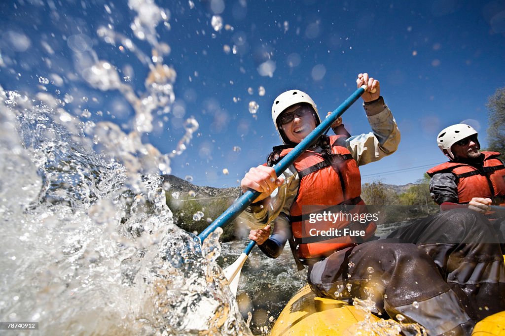 Whitewater Rafters Splashing Water