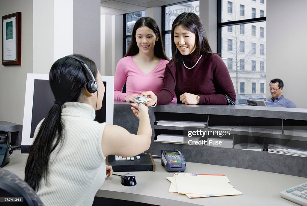 Teenage Girls at Counter at Medical Clinic