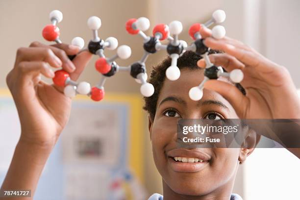 high school student holding molecular model - 16 year old male model stock pictures, royalty-free photos & images