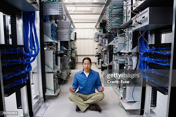 computer technician meditating server room - correct sitting posture stock pictures, royalty-free photos & images