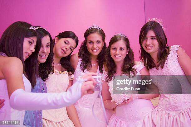 girls at coming of age party photographing themselves - quinceanera party stock pictures, royalty-free photos & images