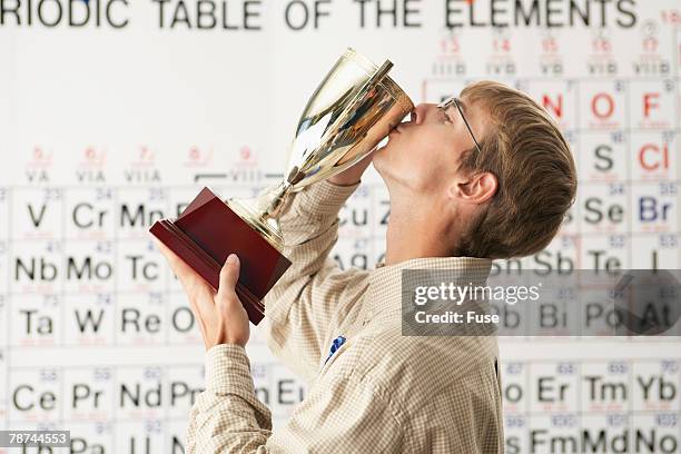 student kissing trophy - teen awards bildbanksfoton och bilder