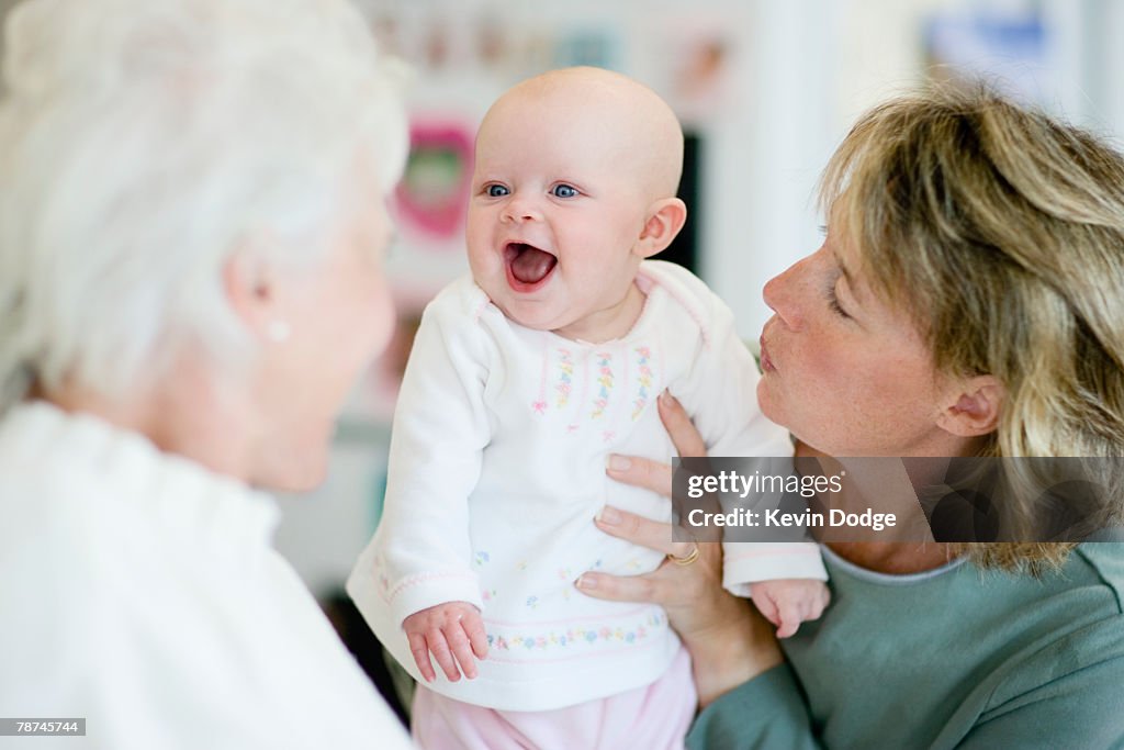 Mother and Grandmother Adoring New Baby