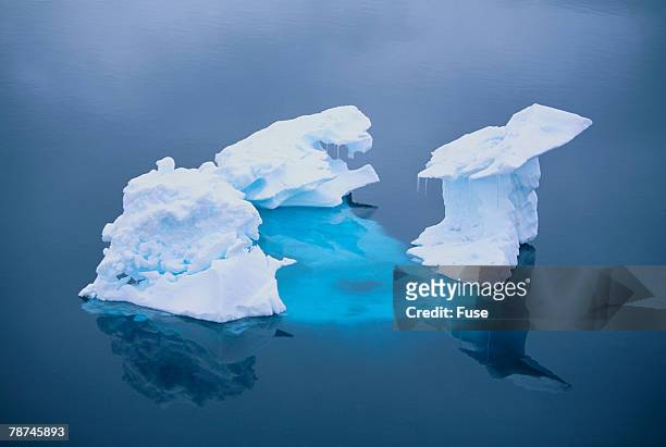 iceberg seen above and below water - iceberg above and below water stock pictures, royalty-free photos & images