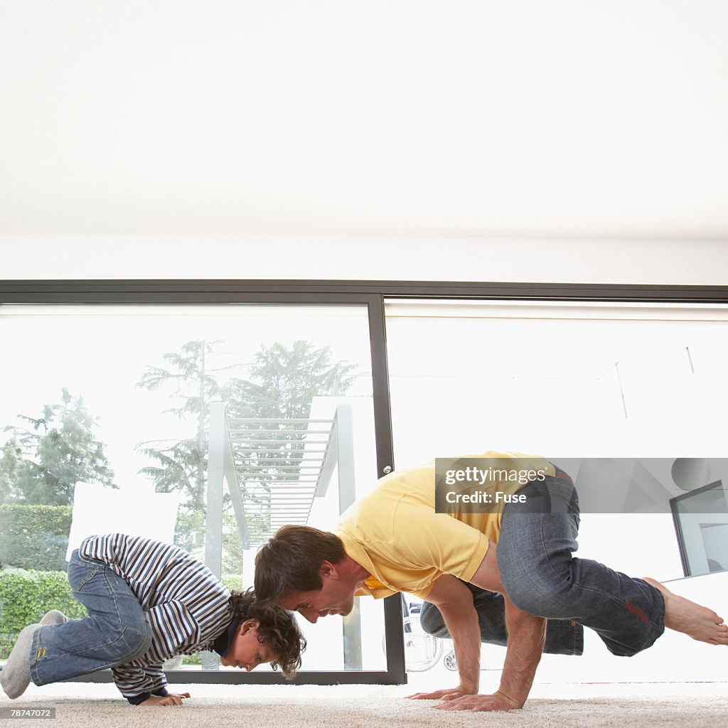 Father and Son Balancing Together