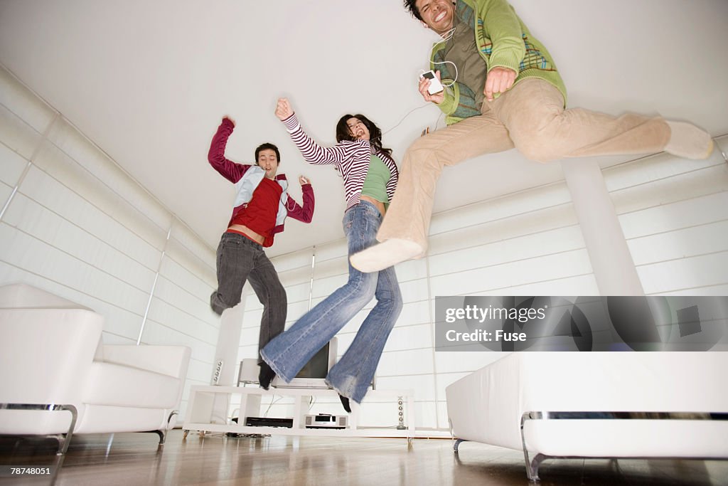 Friends Jumping Around in Living Room