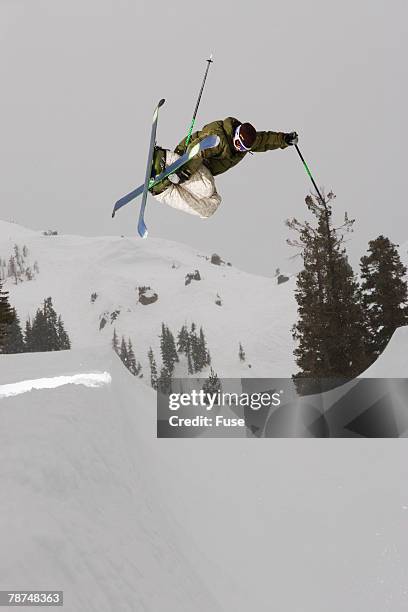 freestyle skier in a halfpipe - snow ramp stock pictures, royalty-free photos & images