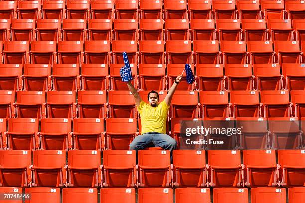 enthusiastic sports fan in stadium - stadium seats stock pictures, royalty-free photos & images