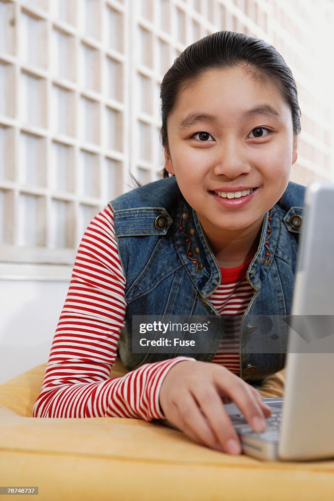 Pre-teen Girl Using Laptop