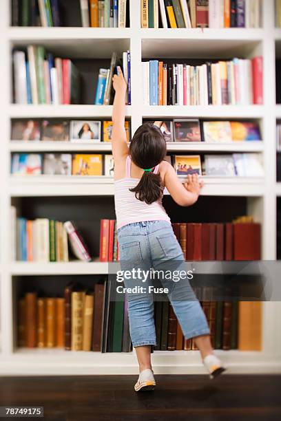 Reaching Books Child Reaching For Book Photos and Premium High Res Pictures - Getty Images