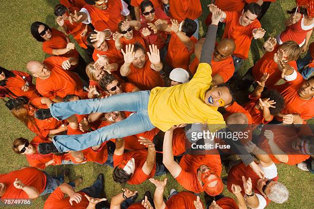 young woman crowd surfing - crowd surfing stock pictures, royalty-free photos & images