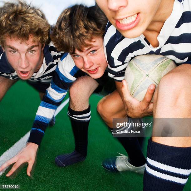 teenage rugby players in scrum - kids rugby stock pictures, royalty-free photos & images