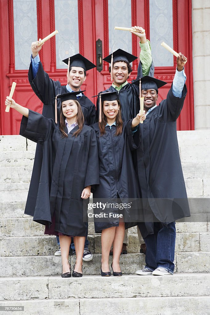 College Graduates Showing Off Their Diplomas High-Res Stock Photo ...