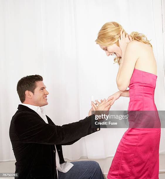young man proposing - kneeling stock pictures, royalty-free photos & images