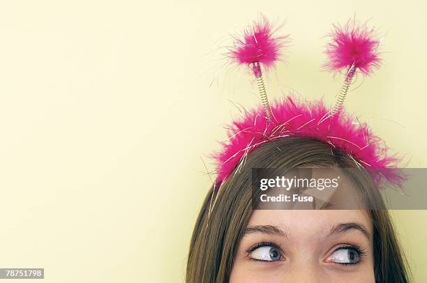 teenage girl in feather headband - headwear ストックフォトと画像