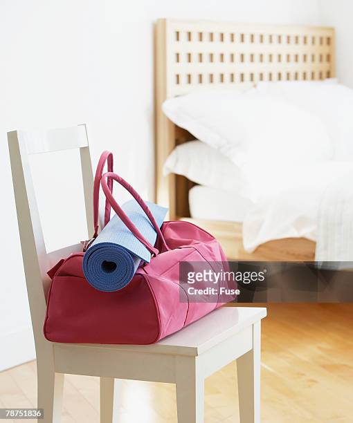 gym bag in a chair - duffle bag stock pictures, royalty-free photos & images