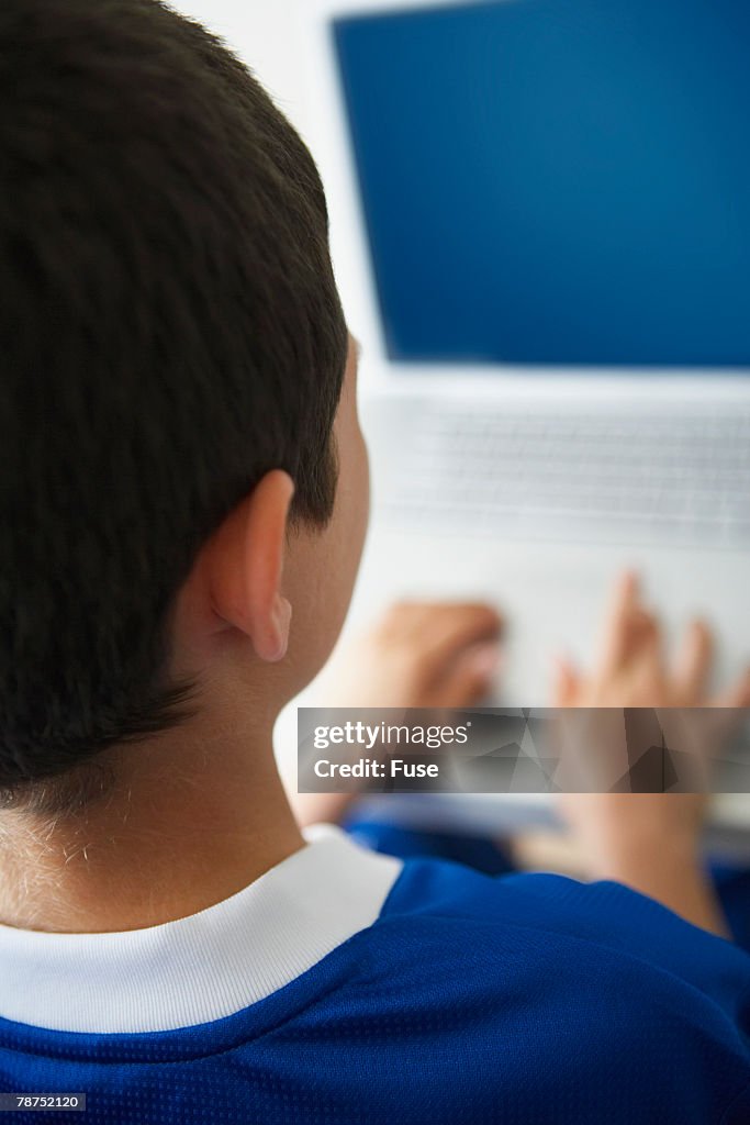 Boy Using Laptop