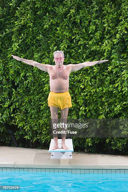 senior man on diving board - old people diving stock pictures, royalty-free photos & images