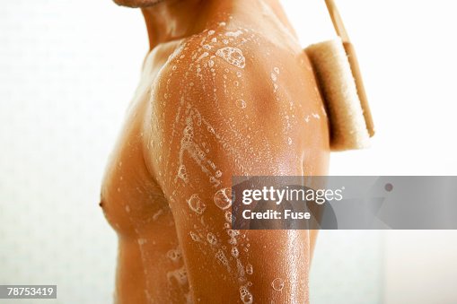 Man Using Back Scrubber Man Using Back Scrubber