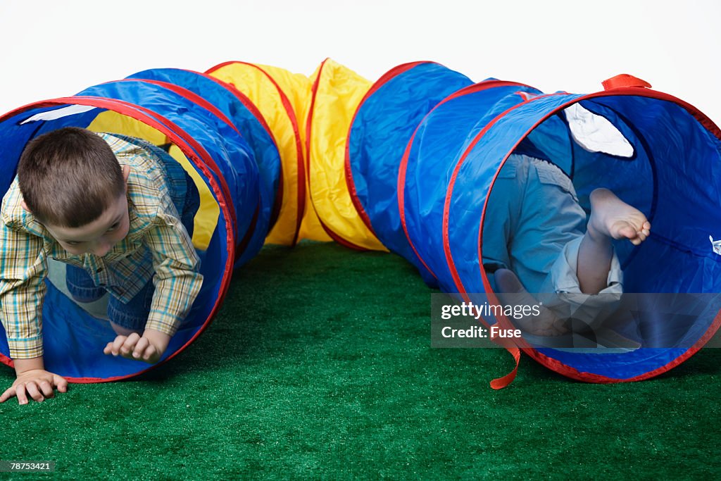 Friends Playing in a Toy Tunnel