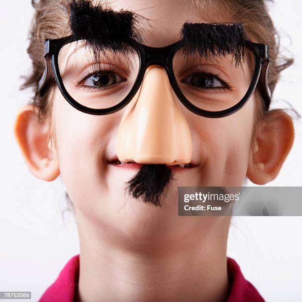 girl wearing groucho glasses - groucho marx disguise stock pictures, royalty-free photos & images