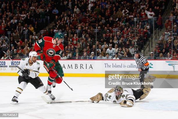 Marian Gaborik of the Minnesota Wild scores a goal against Marty Turco of the Dallas Stars during the game at Xcel Energy Center on January 03, 2008...