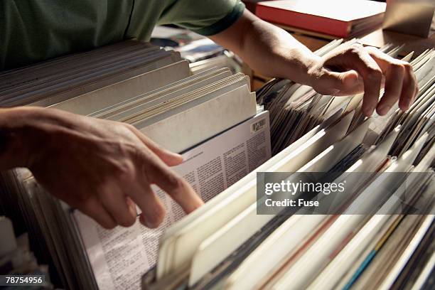 man in record store - record store stock pictures, royalty-free photos & images