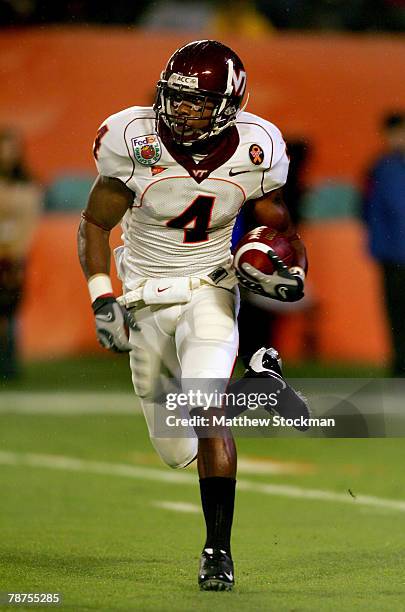 Eddie Royal of the Virginia Tech Hokies carries the ball during the FedEx Orange Bowl against the Kansas Jayhawks at Dolphin Stadium on January 3,...