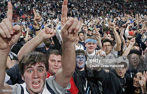 Villanova fans storm the court and celebrate Monday, February 13, 2006 at the Wachovia Center in Philadelphia, PA. Villanova University upset...
