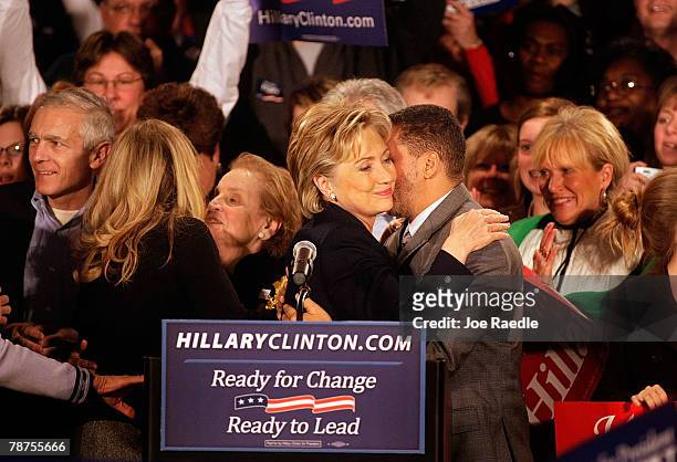 Democratic presidential candidate Sen. Hillary Clinton hugs a supporter while taking the stage at a caucus night gathering at the Hotel Fort Des...