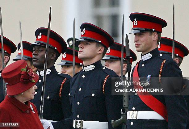 This file picture taken 15 December 2006 shows Britain's Prince William under review by his grandmother Queen Elizabeth II, during the Sovereign's...