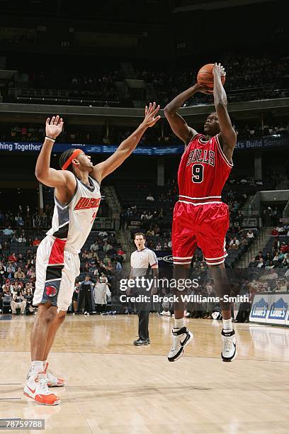 Luol Deng of the Chicago Bulls shoots a jump shot against Jared Dudley of the Charlotte Bobcats during the game on December 5, 2007 at Charlotte...