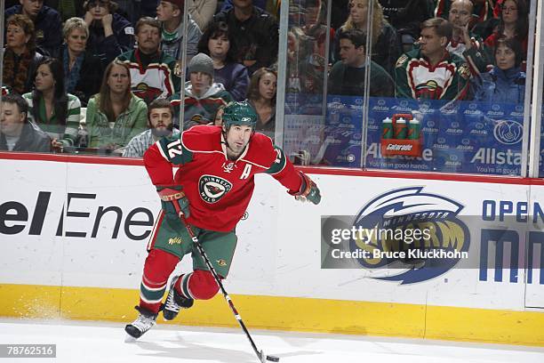 Brian Rolston of the Minnesota Wild skates with the puck against the San Jose Sharks during the game at Xcel Energy Center on December 31, 2007 in...