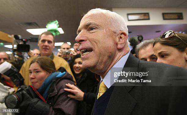 Sen. And Republican presidential contender John McCain greets supporters in Hollis Pharmacy January 4, 2008 in Hollis, New Hampshire. The New...