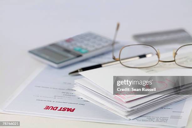 stack of envelopes with pen, calculator, glasses and credit card - billing accuracy stock pictures, royalty-free photos & images