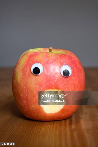 an red apple with a face - anthropomorphic face stock pictures, royalty-free photos & images