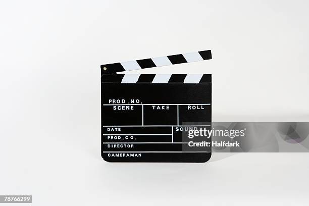 a movie clapperboard - clapboard fotografías e imágenes de stock