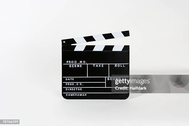 a movie clapperboard - カチンコ ストックフォトと画像