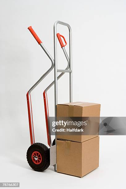 a sack barrow loaded with boxes - brown box stock pictures, royalty-free photos & images